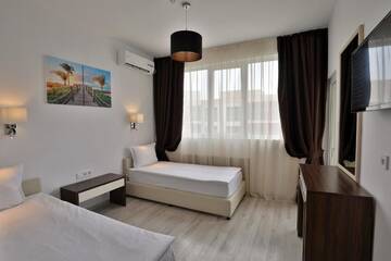 Фото номера Two-Bedroom Deluxe Suite with Balcony Отель Prestige Deluxe Hotel Aquapark Club- All inclusive г. Золотые Пески 14