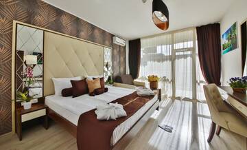 Фото номера Two-Bedroom Deluxe Suite with Balcony Отель Prestige Deluxe Hotel Aquapark Club- All inclusive г. Золотые Пески 28